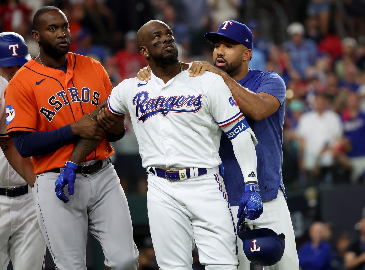 Oct 20, 2023; Arlington, Texas, USA; Texas Rangers right fielder Adolis Garcia (53) is held back by Houston Astros left fielder Yordan Alvarez (44) as Rangers player Ezekiel Duran talks to him after he was hit by a pitch during the eighth inning of game five in the ALCS for the 2023 MLB playoffs at Globe Life Field. Mandatory Credit: Kevin Jairaj-USA TODAY Sports